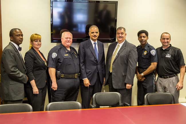 U.S. Attorney General Eric Holder with law enforcement