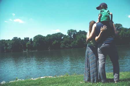 image of family by the lake for article on families of addicted people