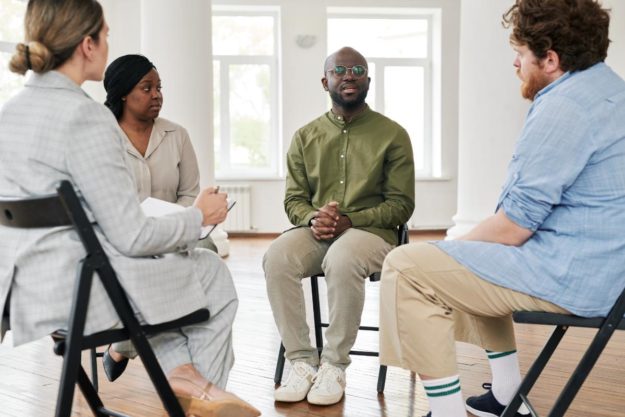 people in an inpatient drug rehab thrive in a group therapy session after having taken the time to chose the right rehab programs for themselves
