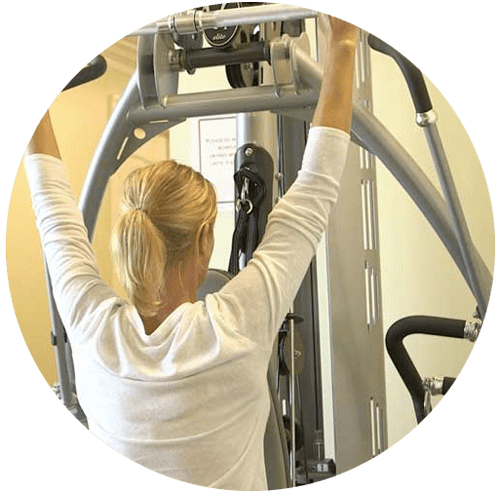 image of woman at one of Gulf Breeze Recovery's exercise stations. Gulf Breeze Recovery's non 12 step holistic drug and alcohol program is called THRIVE® and promotes Total Health Recovery