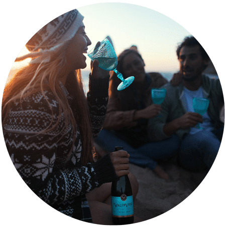 an image of young woman drinking on the beach for blog article entitled "What do we lose by numbing a feeling?" for Gulf Breeze Recovery non-12 step holistic drug and alcohol rehab