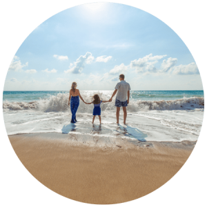 image of family playing in the surf at the beach for blog post article entitled " How do you help someone who is addicted?" for Gulf Breeze Recovery non-12 step holistic drug and alcohol rehab