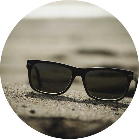 image of sunglasses on the beach for a blog article entitled "no problems, just situations" for Gulf Breeze Recovery non 12 step holistic drug rehab