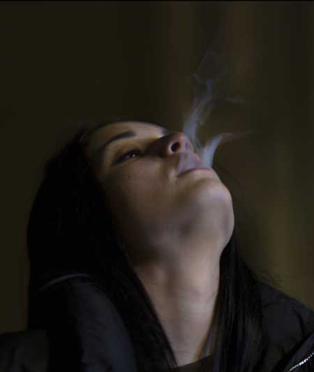 image of woman smoke trailing out of her mouth for blog article entitled "Sky's Story of addiction" for Gulf Breeze Recovery non 12 step holistic drug and alcohol treatment program