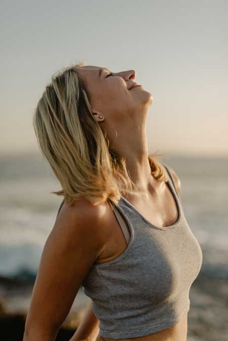 image of woman enjoying the view for blog article entitled: "How Mindfulness and Serenity promote Recovery." for Gulf Breeze Recovery a non-12 step holistic drug and alcohol rehab
