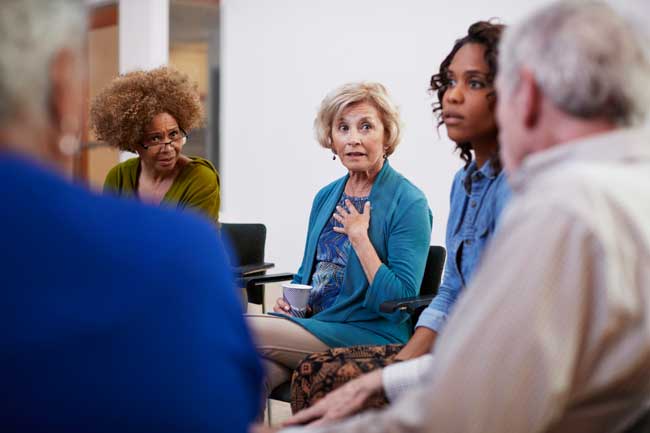 image of group therapy meeting talking about non-12 step holistic inside-out understanding of how our minds work when we are in our innate health