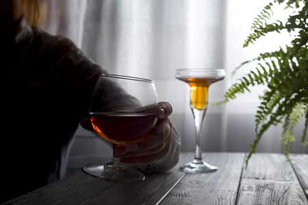 image of drinking alcohol alone-Denial is common for people with substance use disorder-for Gulf Breeze Recovery non-12 step holistic drug and alcohol treatment center