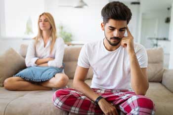 image of unhappy couple in crisis. Families often struggle to get a loved one into treatment for an alcohol or drug addiction. Gulf Breeze Recovery non-12 step holistic drug and alcohol rehab