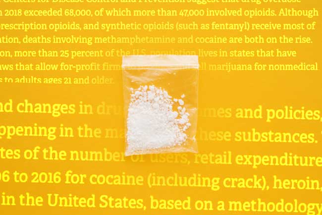 image of drugs on yellow background with copy from report that Shines Light on Nation’s Increase in Illegal Drug Spending and Chronic Users for Gulf Breeze Recovery non 12 step drug and alcohol holistic rehab