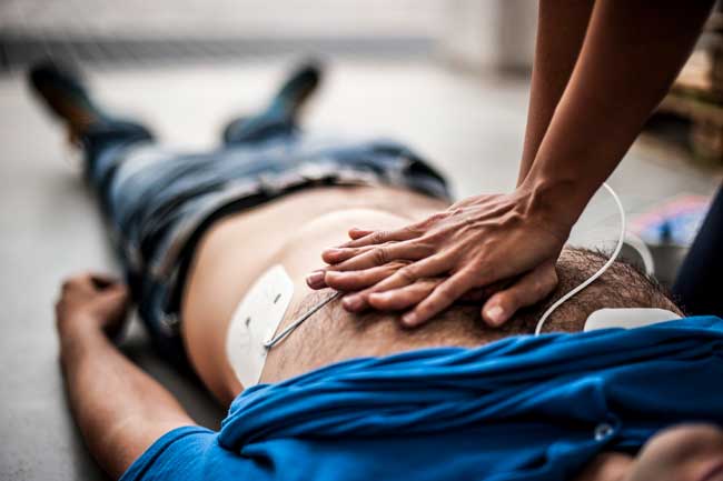 image of man being resuscitated after opioid overdose underscoring need for drug treatment
