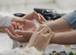 Hands of two people in holistic substance abuse treatment