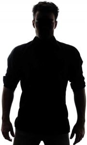 man in silhouette facing camera 
