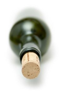 image of wine bottle in it's side for article on alcohol-induced mortality