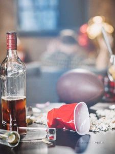 image of after new year's party mess for "Why New Year Resolutions Don’t Work on Alcohol Addiction"