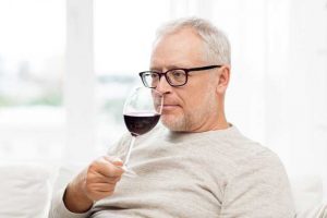 man sipping wine "Alcoholism Today in Seniors and Younger Generations"