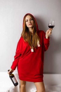 image of woman drinking wine for Gulf Breeze Recovery 'Early Alcohol Sensitivity Can Help Predict Predisposition to Alcohol Use Disorder'