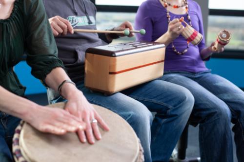people engaged in a music therapy program