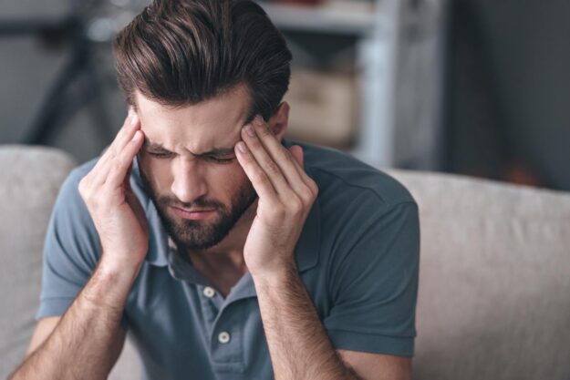 A man experiencing the effects of alcohol