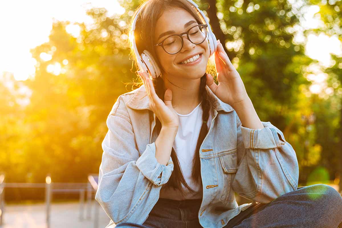 person listening to headphones experiencing music and recovery