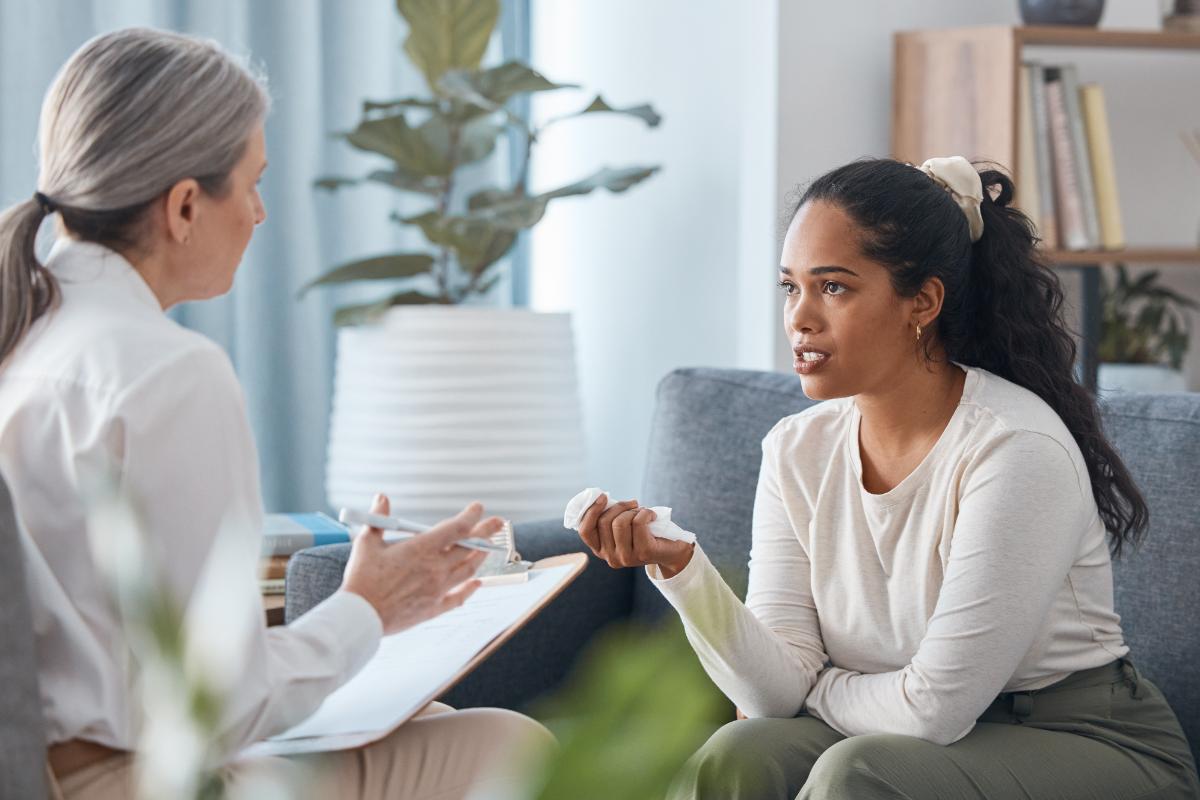 A woman asking a therapist, "What is AA?"