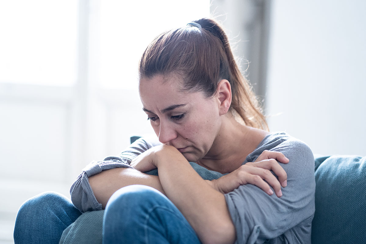 woman sitting and think about ptsd and substance abuse in veterans