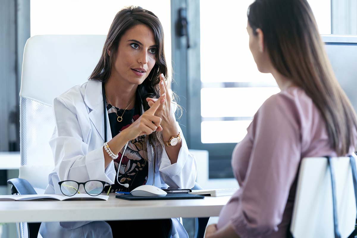 doctor explaining to young woman the dangers of fentanyl and heroin