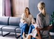 female therapist explaining to young woman the benefits of non 12 step therapy