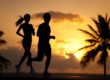 two exercise buddies jog at sunset as part of a holistic exercise therapy program for addiction