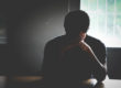 Man sitting in the dark, recognizing cocaine abuse signs in himself