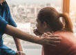 Hand of a person on someone else's shoulders while explaining meth addiction facts