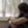 Man looking out from window, needing heroin addiction help