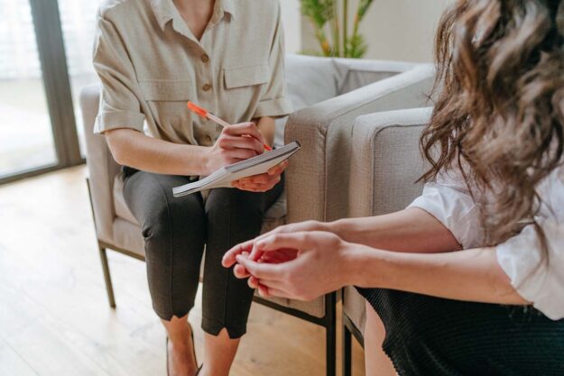 Hands of people discussing how to treat heroin addiction