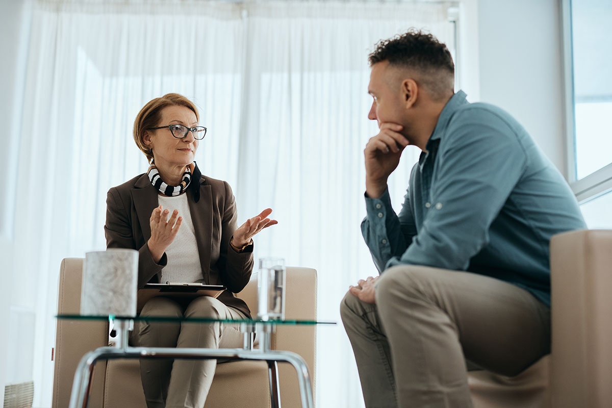 Counselor and patient discussing a treatment plan for depression