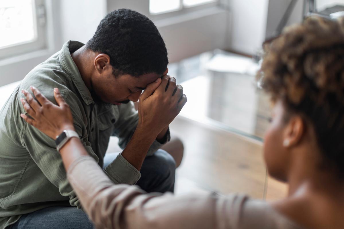compassionate counselor comforting person struggling with fentanyl addiction signs