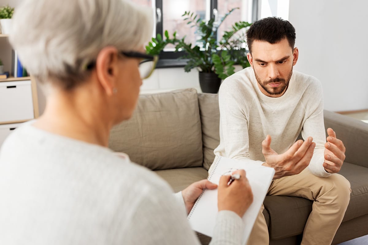 person discussing anxiety vs depression with therapist