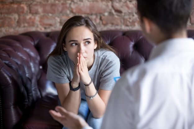 person discussing depression treatment options with therapist