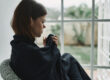 A woman thinking about her signs of opioid withdrawal
