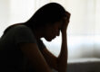 A woman thinking about the Florida opioid crisis