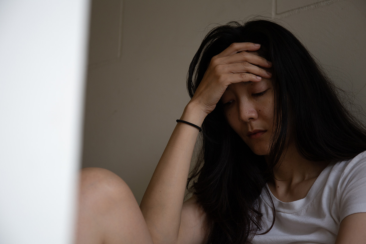 A woman wondering, "Are opioids illegal in Florida?"