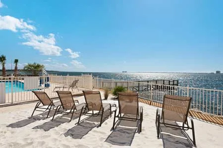 image of gulf breeze recovery's private beach and pool area. Leaders in non-12 step holistic drug and alcohol treatment