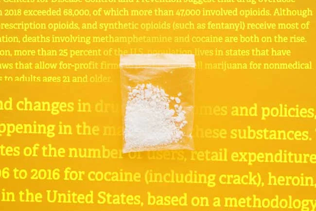 image of drugs on yellow background with copy from report that Shines Light on Nation’s Increase in Illegal Drug Spending and Chronic Users for Gulf Breeze Recovery non 12 step drug and alcohol holistic rehab