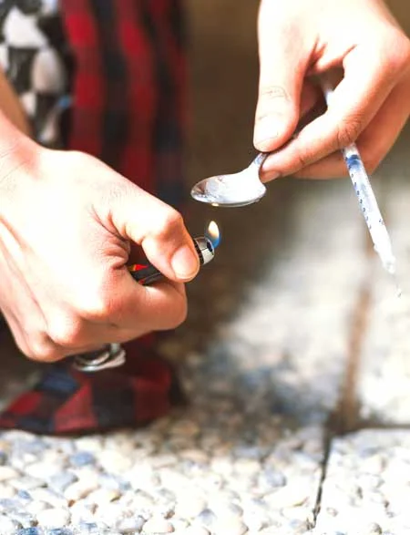 image of girl preparing for iv drug use