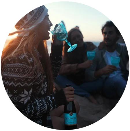 an image of young woman drinking on the beach for blog article entitled "What do we lose by numbing a feeling?" for Gulf Breeze Recovery non-12 step holistic drug and alcohol rehab