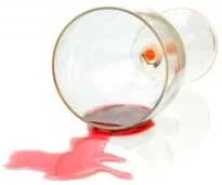 image of glass of spilled wine