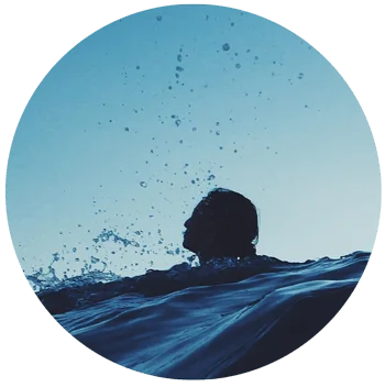 an image of person with head above water for blog article entitled "What do we lose by numbing a feeling?" for Gulf Breeze Recovery non-12 step holistic drug and alcohol rehab
