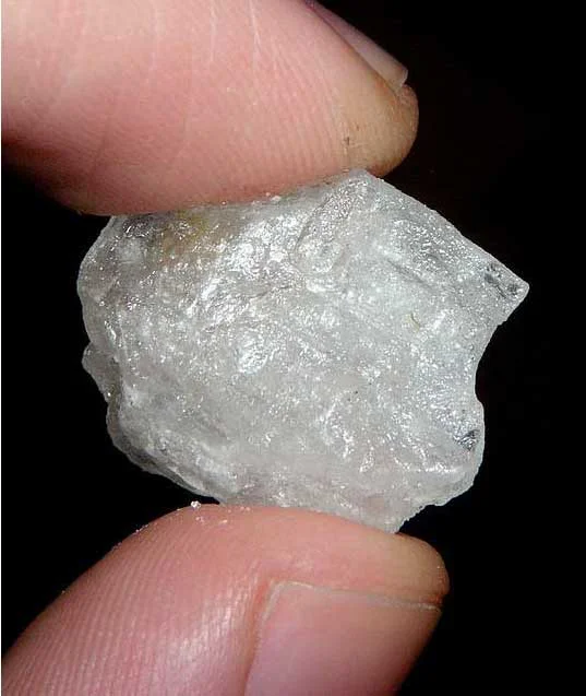 holding single rock of meth