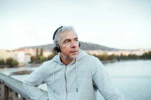 mature-male-runner-with-headphones-outdoors-950px