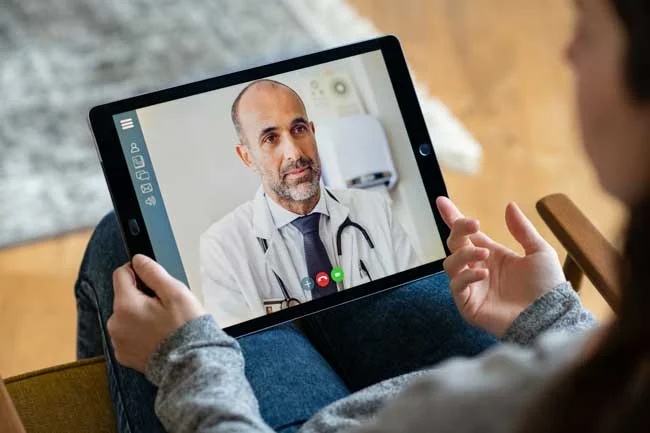 image of doctor consulting online with patient