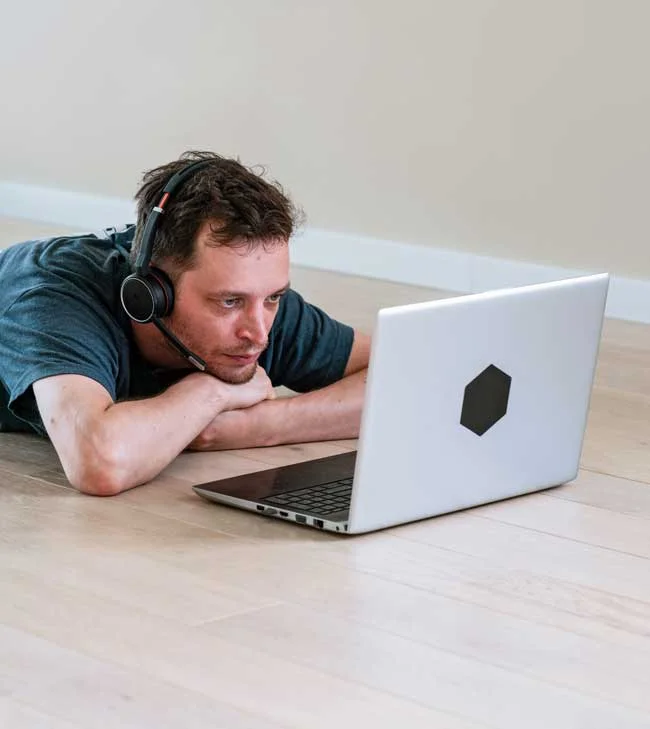 image of man utilizing tele therapy