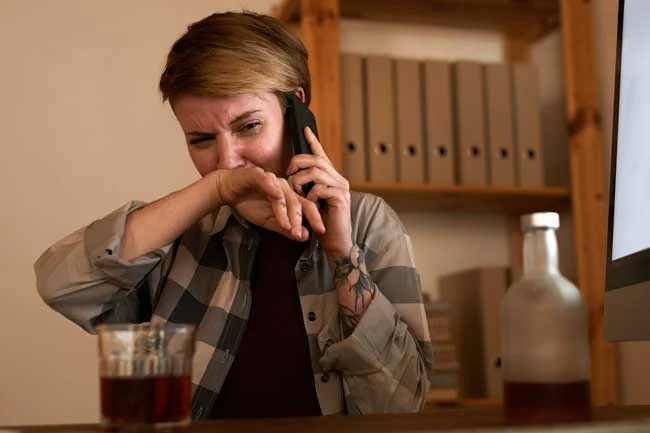 image of woman with alcohol problems on phone